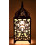 Original lamp in wrought iron craft. Baroque decoration on the cheap.