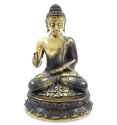Buddha statue protection seated in bronze. Decoration handicraft Asia.