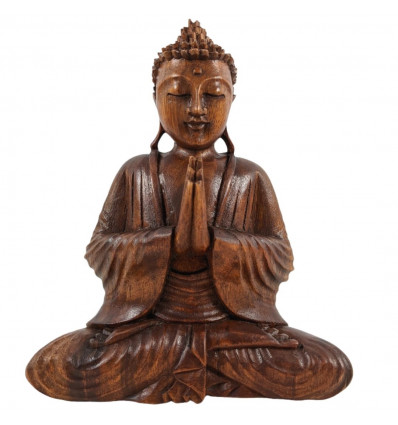 Wooden seated Zen Buddha statuette. Decoration handicrafts from Asia.